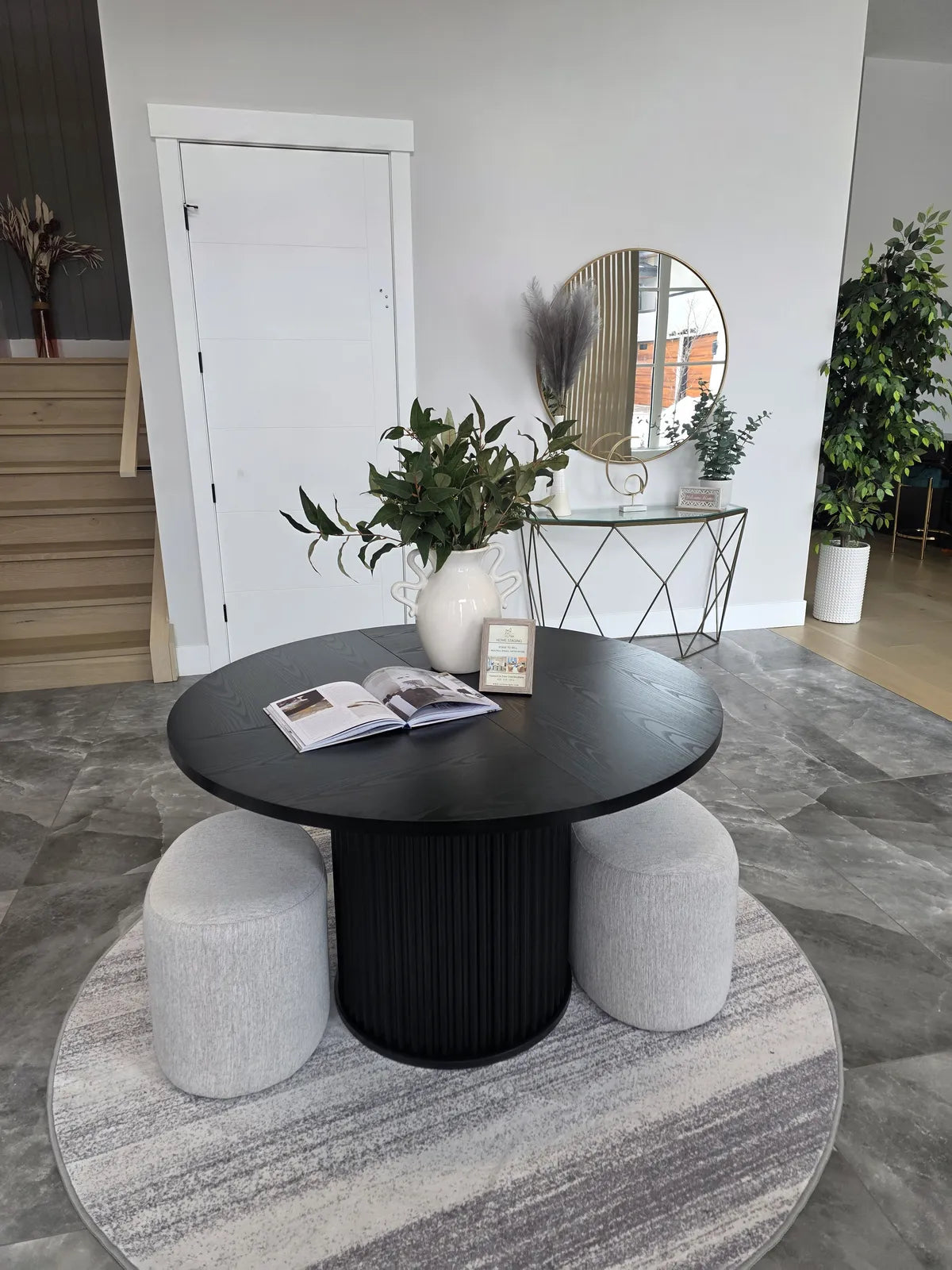 Entry vignette with a round table and mirror