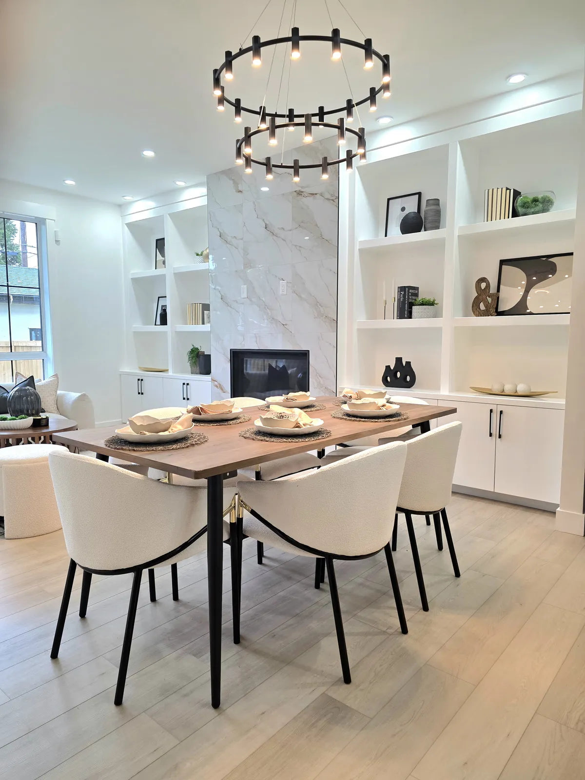 Dining room with a round table and cream upholstered chairs