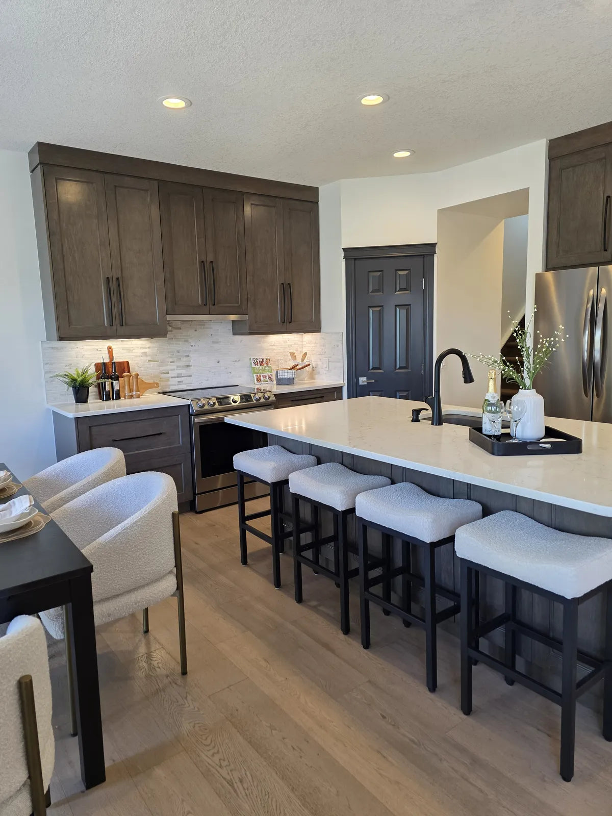 Kitchen with a large island and counter stools